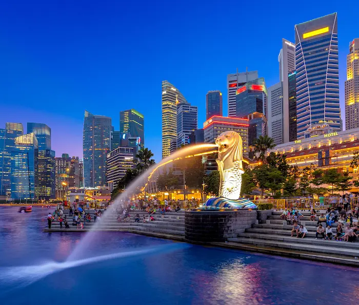 An image of Merlion in Singapore with people around.