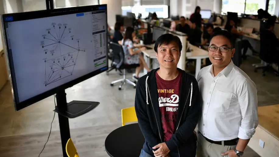 Mr Charles Poon (left) and Mr Daryl Neo, co-founders of fintech start-up Handshakes, developed an artificial intelligence-powered business intelligence database called Handshakes.