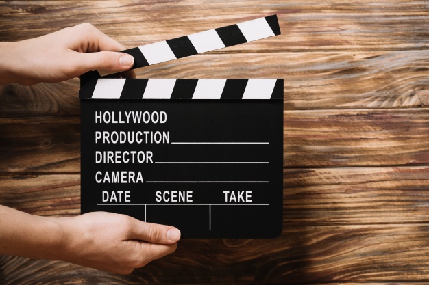 A clapperboard representing developing films in Singapore, in line with IMDA's role in promoting and regulating the media industry
