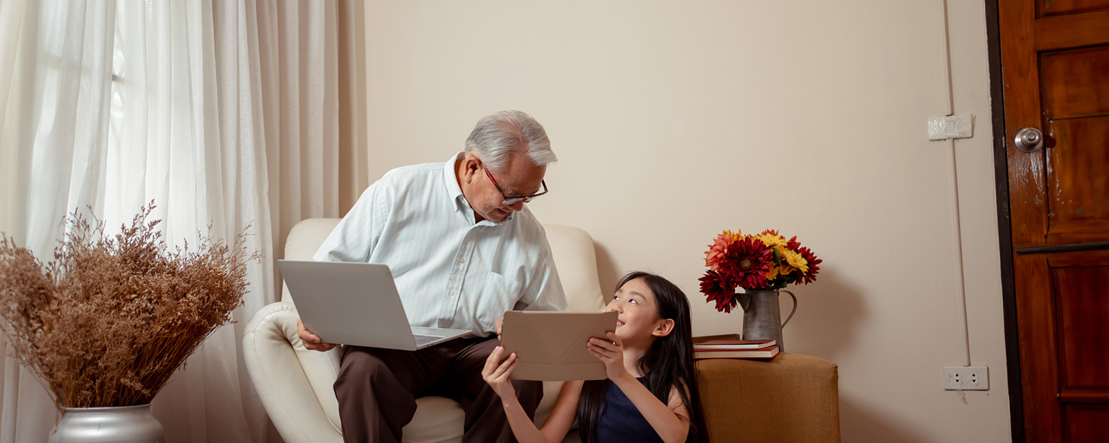 kids interacting with grandparents learning on device