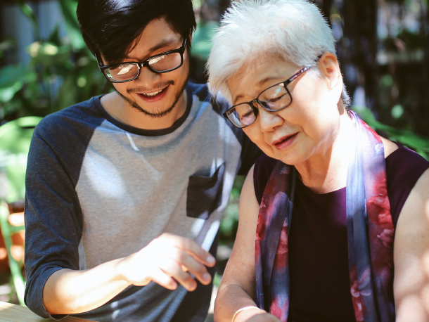 a young man is helping the elder