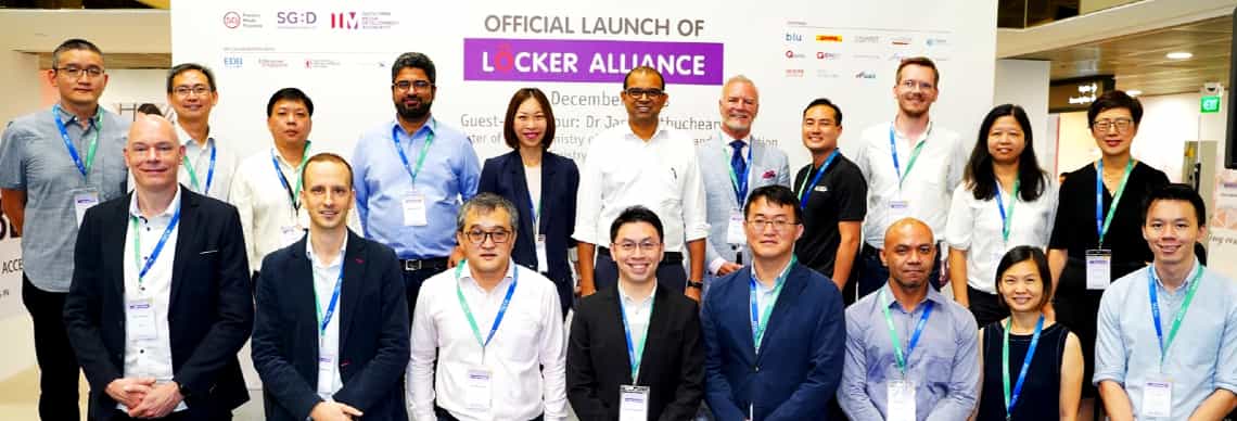 A group photo of Dr Janil Puthucheary and other representatives who officiated the launch of the IMDA's Locker Alliance trial in Punggol