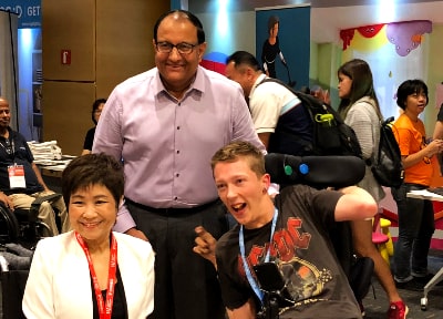 Mr S Iswaran, in a group shot with two keynote speakers of E2Connect 2018 on assistive technology: Ms Chia Yong Yong and Mr Christopher Hills