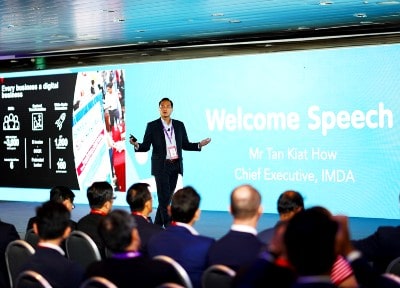 Mr Tan Kiat How Chief Executive of IMDA, gives a welcome speech on stage at IMDA's SG:D Industry Day