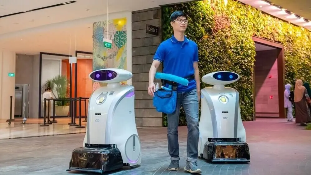 Yi-Wei and Ella, LionsBot’s robots, are seen cleaning efficiently at Jewel Changi Airport
