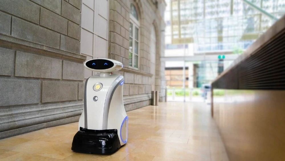 A robot cleaning the building, demonstrating the use of artificial intelligence in Singapore