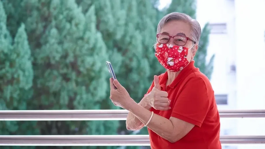 Seniors Go Digital: Mdm Teo Gek Kee gives a thumbs up to the camera