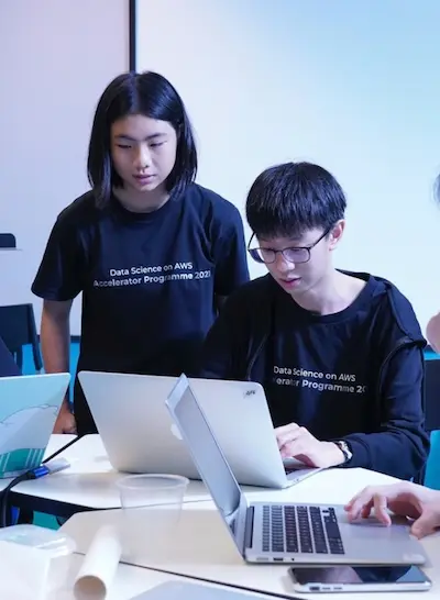 A group of male and female students in the Data Science on AWS Accelerator Programme, promoting IMDA's digital for life initiatives