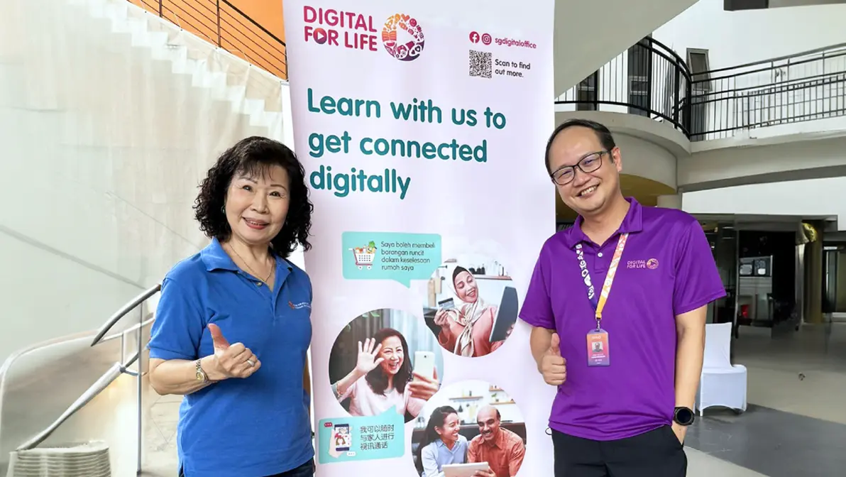 A photo of Madam Tan posing with her Digital Ambassador, Mr Alvin Quak at a digital workshop. 