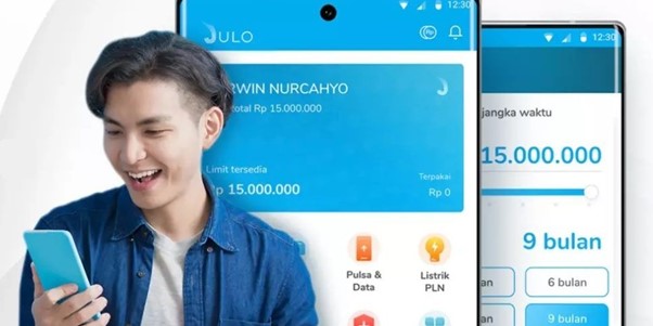 A man smiling at his phone, using IMDA-accredited JULO digital lending services, highlighting the ease of this innovative financial solution