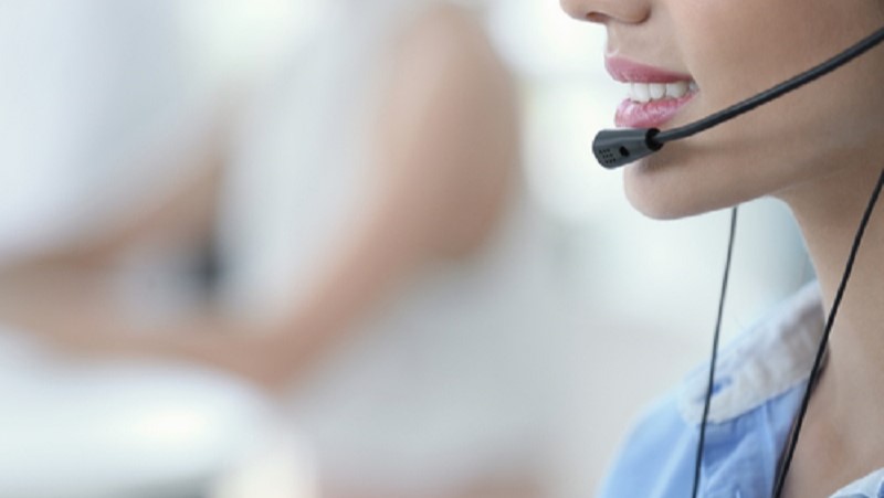 A woman with a headset microphone