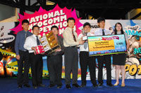 Poly/ITE Circuit champion, Nanyang Polytechnic (School of Information Technology), on stage with RADM(NS) Ronnie Tay, IDA CEO (centre)