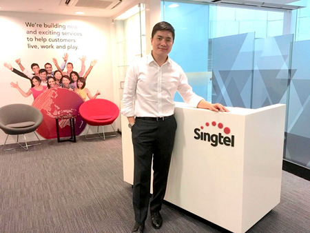 Cybersecurity in Singapore for business: A man posing for a photo at the Singtel office