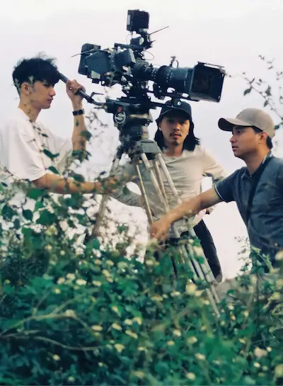 The film crew of Inside the Yellow Cocoon Shell, a Made with SG movie, at work on the set in a Vietnamese countryside.