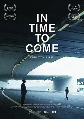 Film poster for "In Time To Come" by Tan Pin Pin, showing silhouettes in an urban tunnel with award laurels.