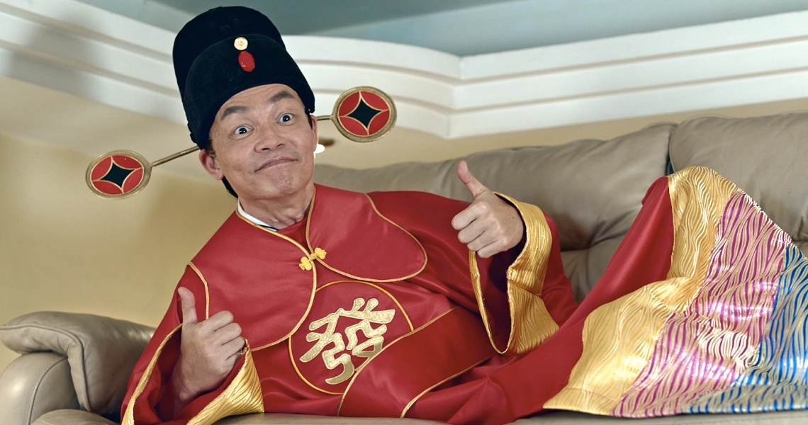 A scene from the Singaporean comedy film 'The Fortune Handbook' showing characters in a vibrant, colorful setting.