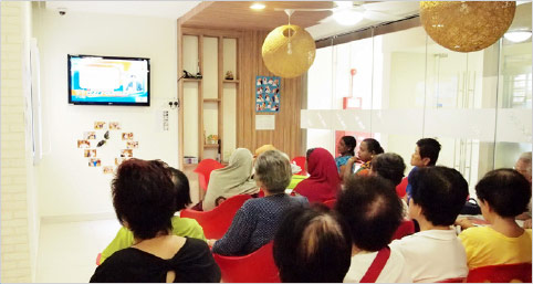 Seniors enjoying digital TV at Senior Activity Centre in Ang Mo Kio.